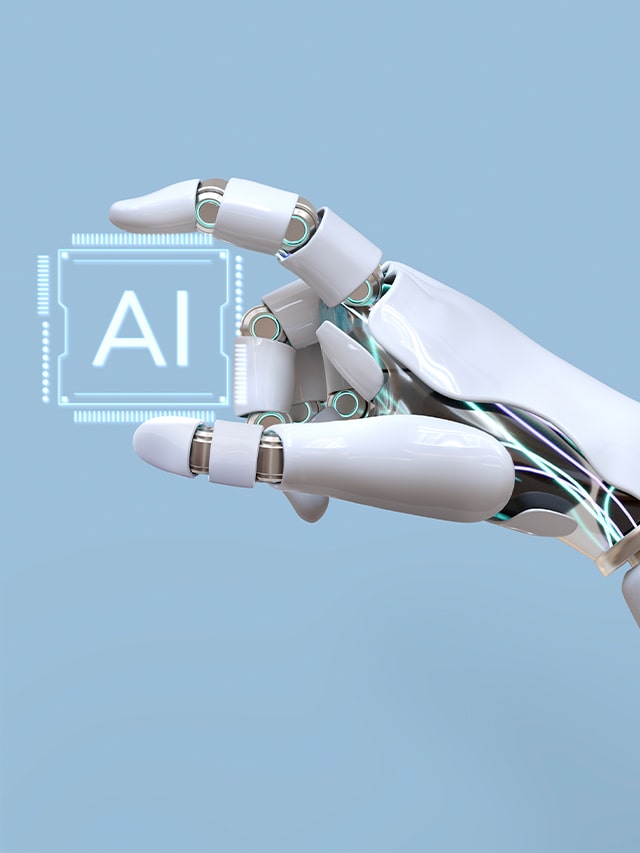 Robot hand holding virtual chip with AI written in blue background; concept of High salary jobs AI can't touch